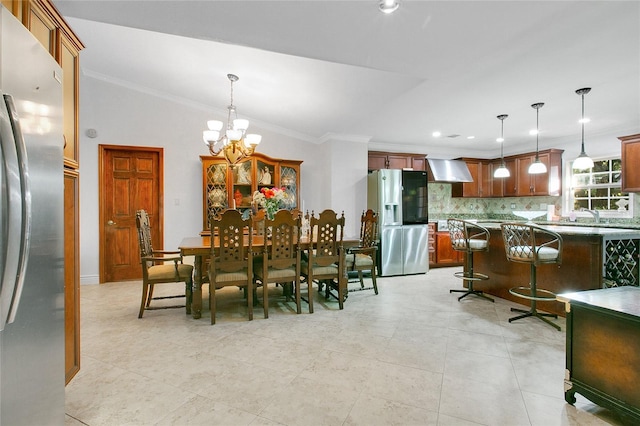 tiled dining area featuring ornamental molding and a notable chandelier