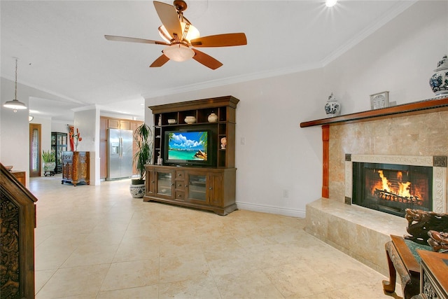 living room with a fireplace, ceiling fan, and crown molding