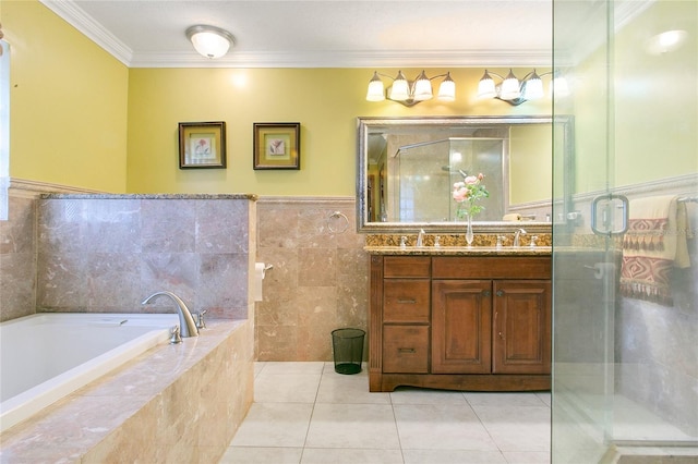 bathroom featuring tile walls, ornamental molding, vanity, tile patterned flooring, and a relaxing tiled tub