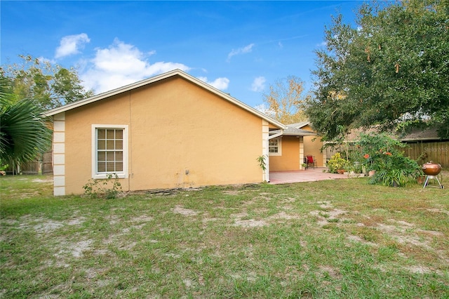 exterior space with a lawn and a patio