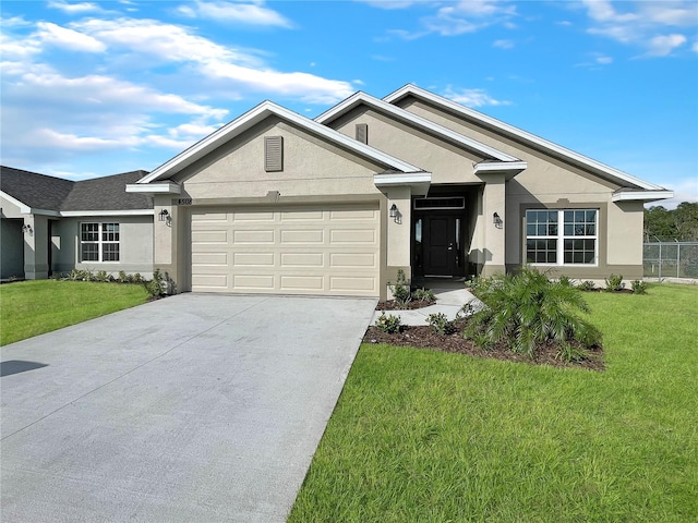 view of front of house with a front yard and a garage