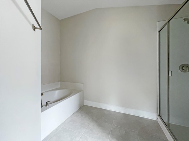 bathroom featuring tile patterned floors, independent shower and bath, and lofted ceiling