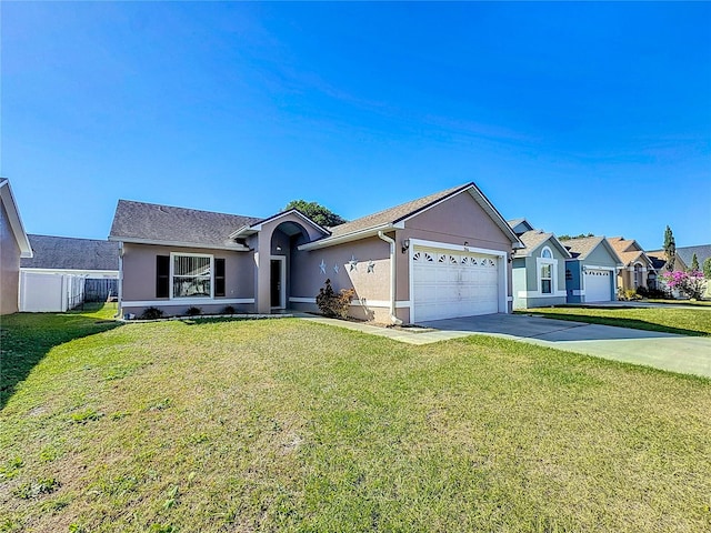 ranch-style home with a garage and a front lawn