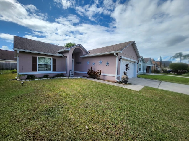 single story home featuring a garage and a front yard