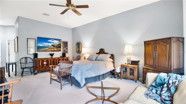 bedroom featuring ceiling fan and light carpet