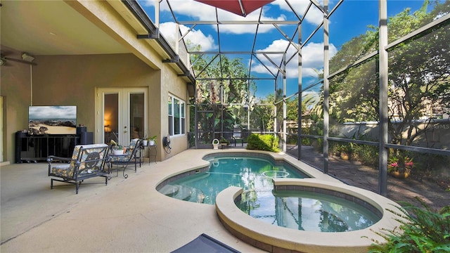 view of swimming pool featuring french doors, an in ground hot tub, a patio area, glass enclosure, and ceiling fan