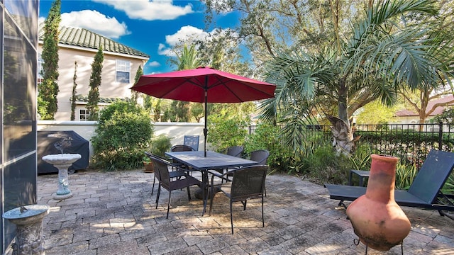 view of patio featuring a grill