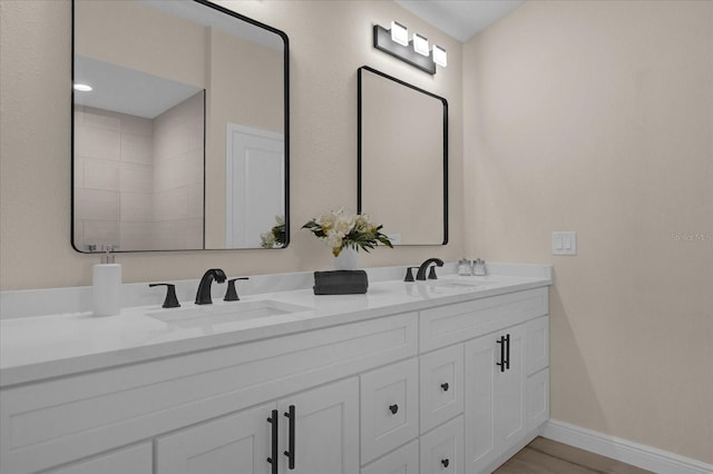 bathroom with vanity and hardwood / wood-style floors