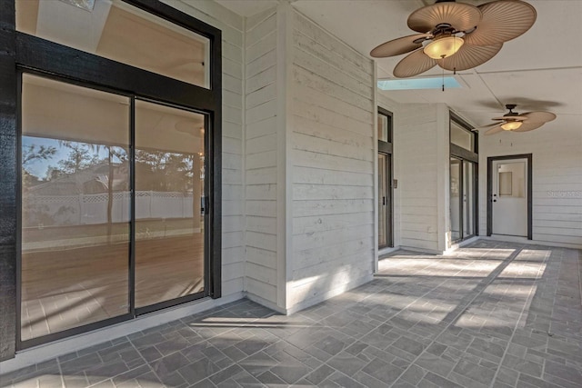 property entrance featuring ceiling fan