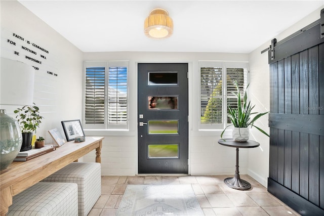 foyer entrance featuring a barn door