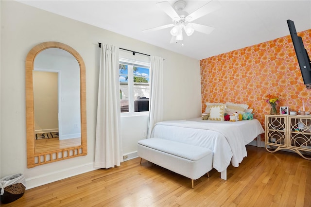 bedroom featuring hardwood / wood-style flooring and ceiling fan