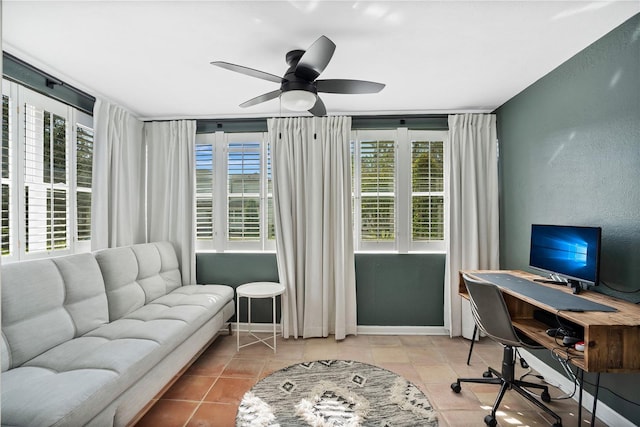 office featuring ceiling fan and light tile patterned flooring