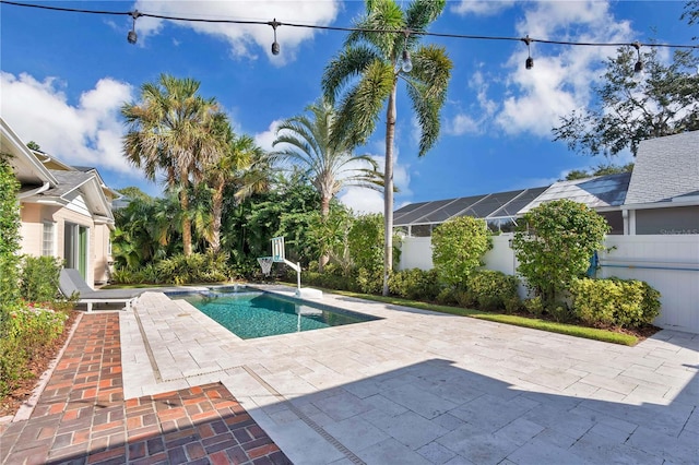 view of swimming pool with a patio area