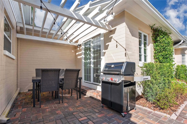 view of patio featuring a pergola and grilling area