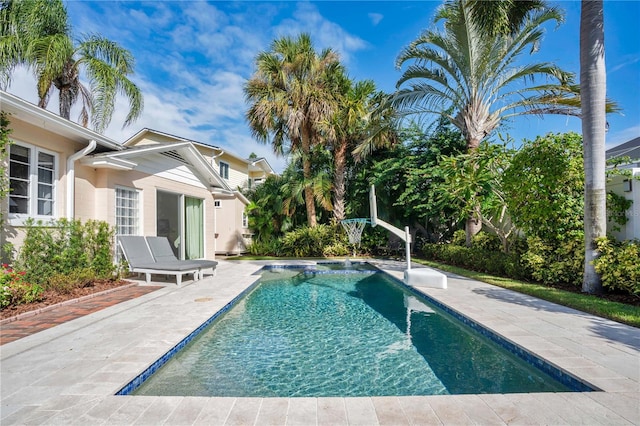 view of pool featuring a patio