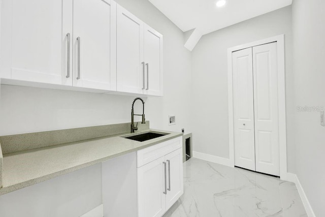 laundry room featuring cabinets, washer hookup, electric dryer hookup, and sink