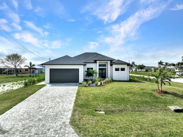 view of front facade featuring a garage and a front lawn