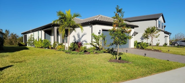 view of property exterior featuring a yard and a garage