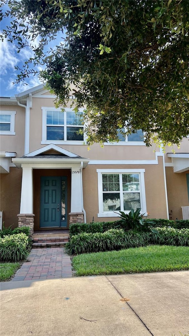 view of exterior entry featuring a porch