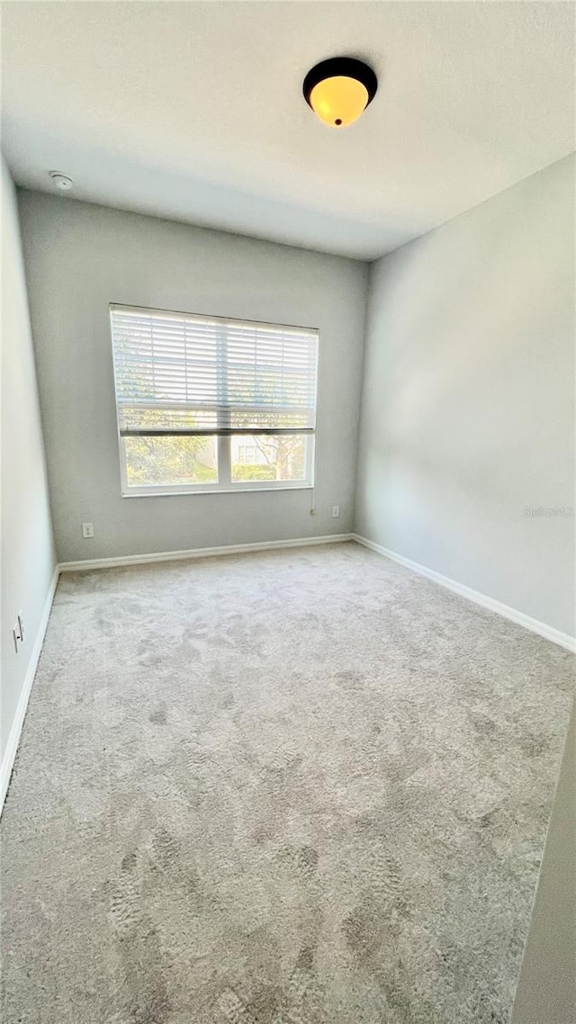 empty room with carpet flooring