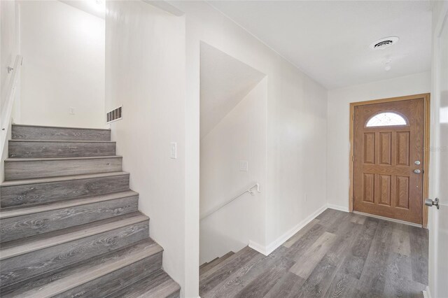 foyer with wood-type flooring