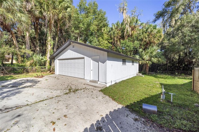 garage featuring a lawn