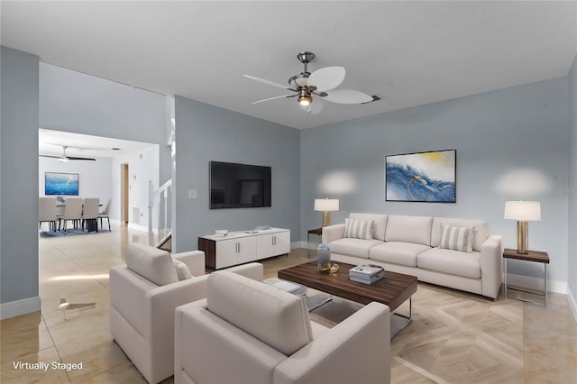 living room with light parquet floors and ceiling fan