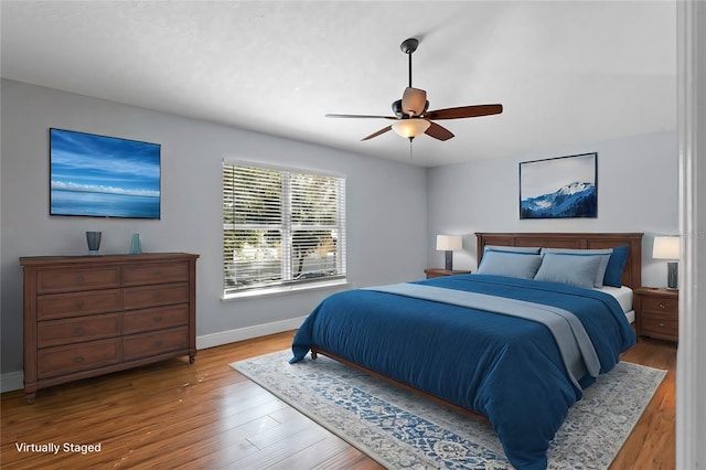 bedroom featuring hardwood / wood-style flooring and ceiling fan