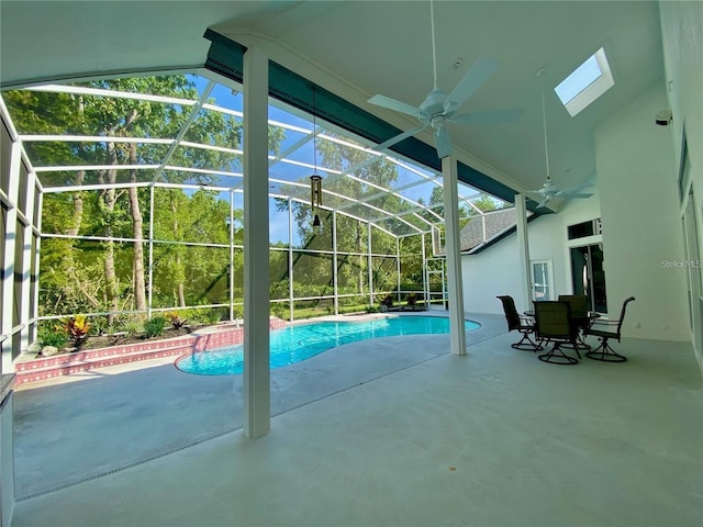 view of swimming pool with ceiling fan, a lanai, and a patio