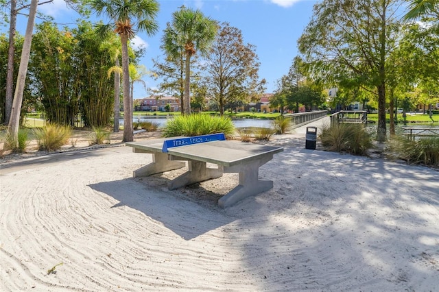 surrounding community featuring a water view