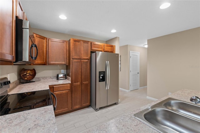 kitchen featuring light hardwood / wood-style floors, stainless steel appliances, and sink