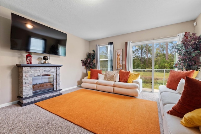 living room with carpet floors and a fireplace