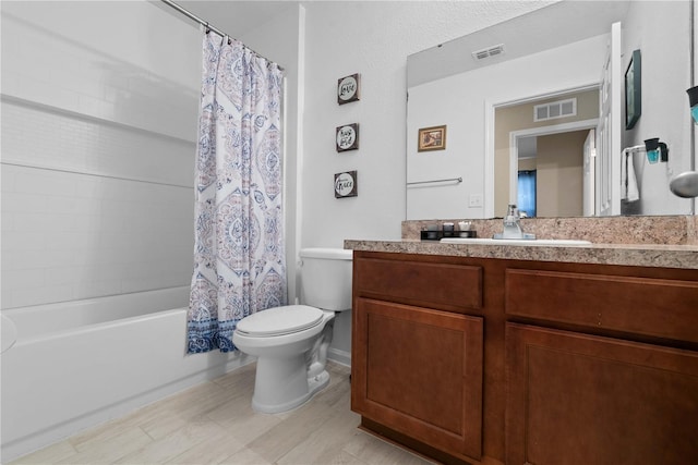 full bathroom featuring vanity, toilet, and shower / bath combination with curtain