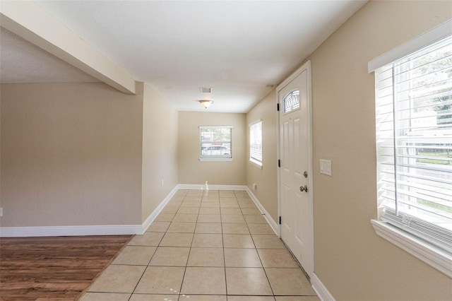 entryway with light hardwood / wood-style floors