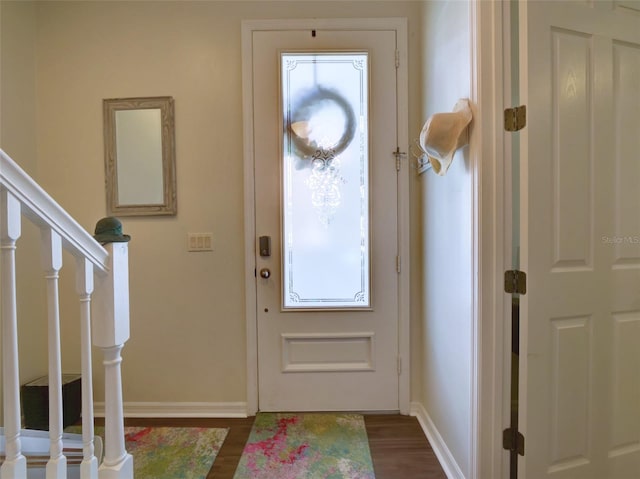 foyer entrance featuring dark hardwood / wood-style floors