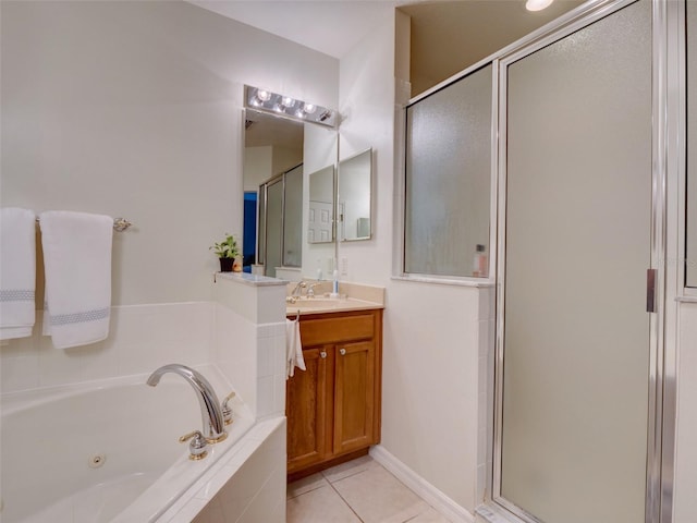 bathroom featuring a whirlpool tub, a shower stall, tile patterned flooring, and vanity