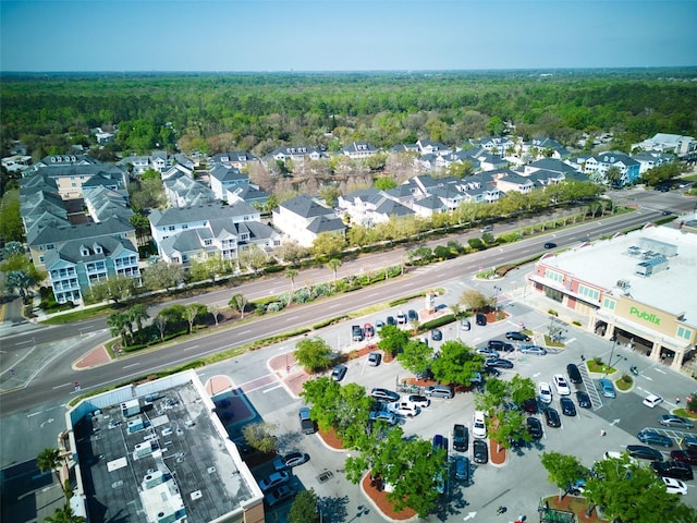 bird's eye view featuring a wooded view