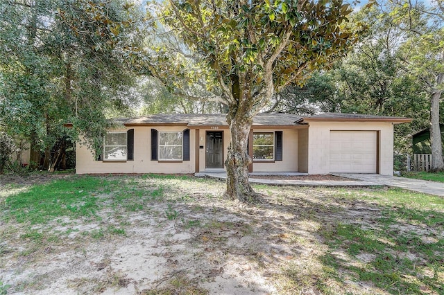 single story home featuring a garage