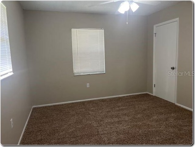 unfurnished room featuring carpet and ceiling fan