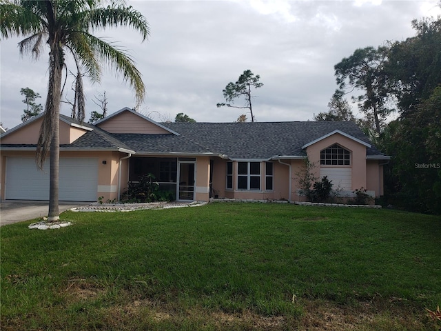 ranch-style house with a front yard and a garage