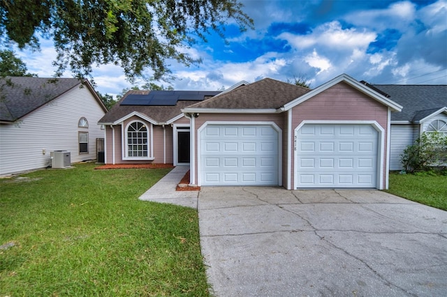 single story home featuring cooling unit, driveway, an attached garage, and a front yard