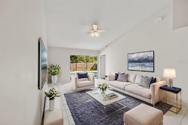 tiled living room with high vaulted ceiling and ceiling fan