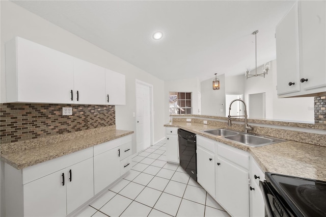 kitchen with black appliances, sink, vaulted ceiling, decorative light fixtures, and white cabinets