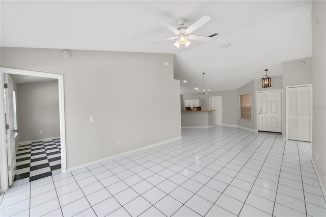 unfurnished living room with light tile patterned floors, ceiling fan with notable chandelier, baseboards, and lofted ceiling