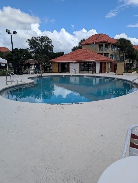 view of pool featuring a patio