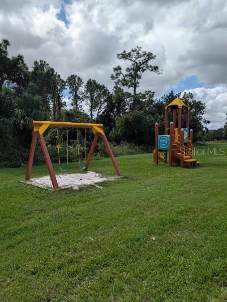 view of jungle gym with a yard