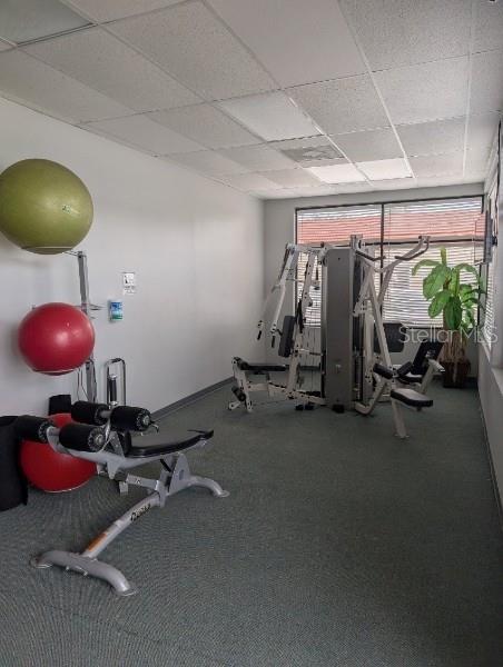 workout area with a drop ceiling