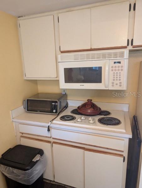 kitchen with white cabinets