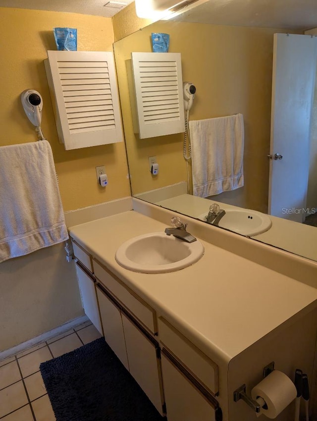 bathroom with vanity and tile patterned floors