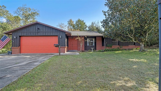 ranch-style house featuring a front yard and a garage